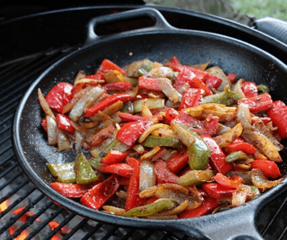 cooking with a cast iron skillet over a fire